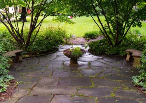 Patio pavers forming a stone walkway in an outdoor space