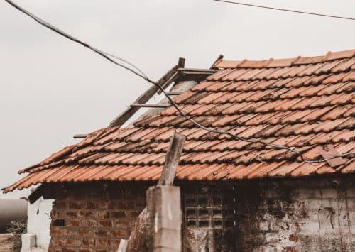 Damaged roof shingles requiring repair in New Orleans
