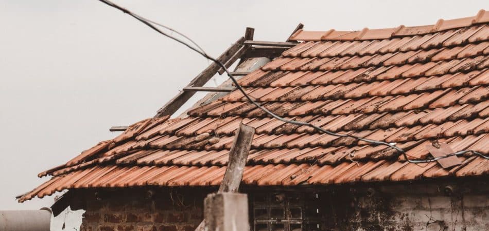 Hail damage visible on roof shingles requiring repair